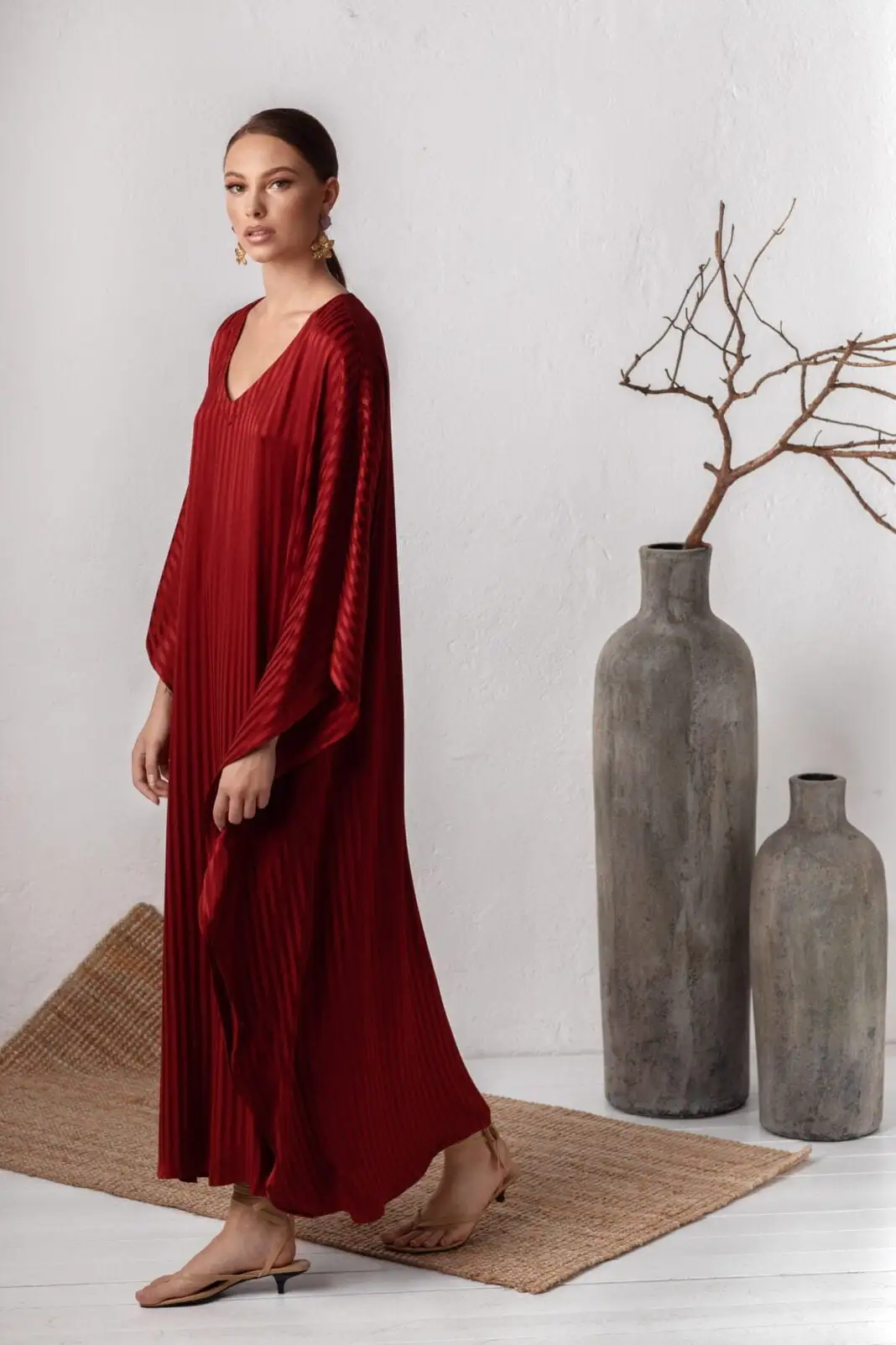 Women wearing red wine color loose maxi dress by house of azoiia
