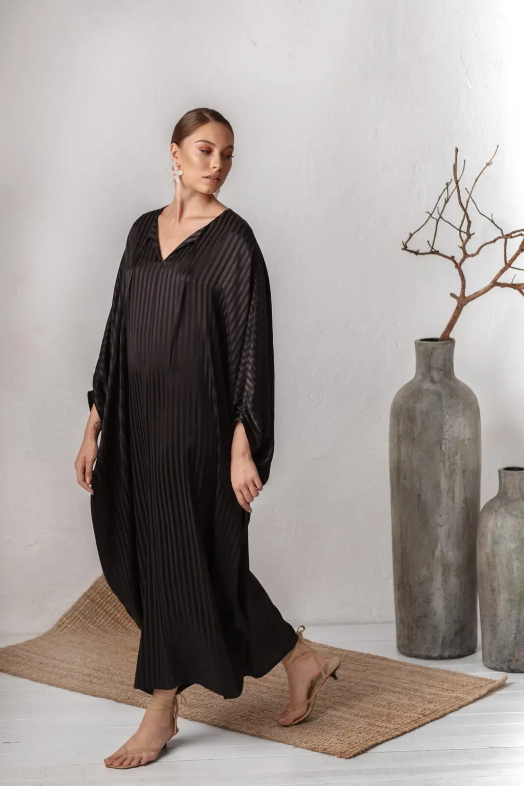 woman wearing long fancy black kaftan dress