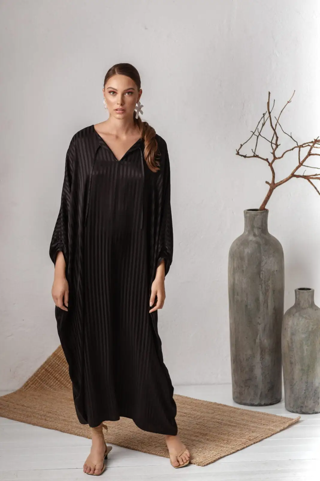 Woman wearing mysterious long black robe dress loose fit